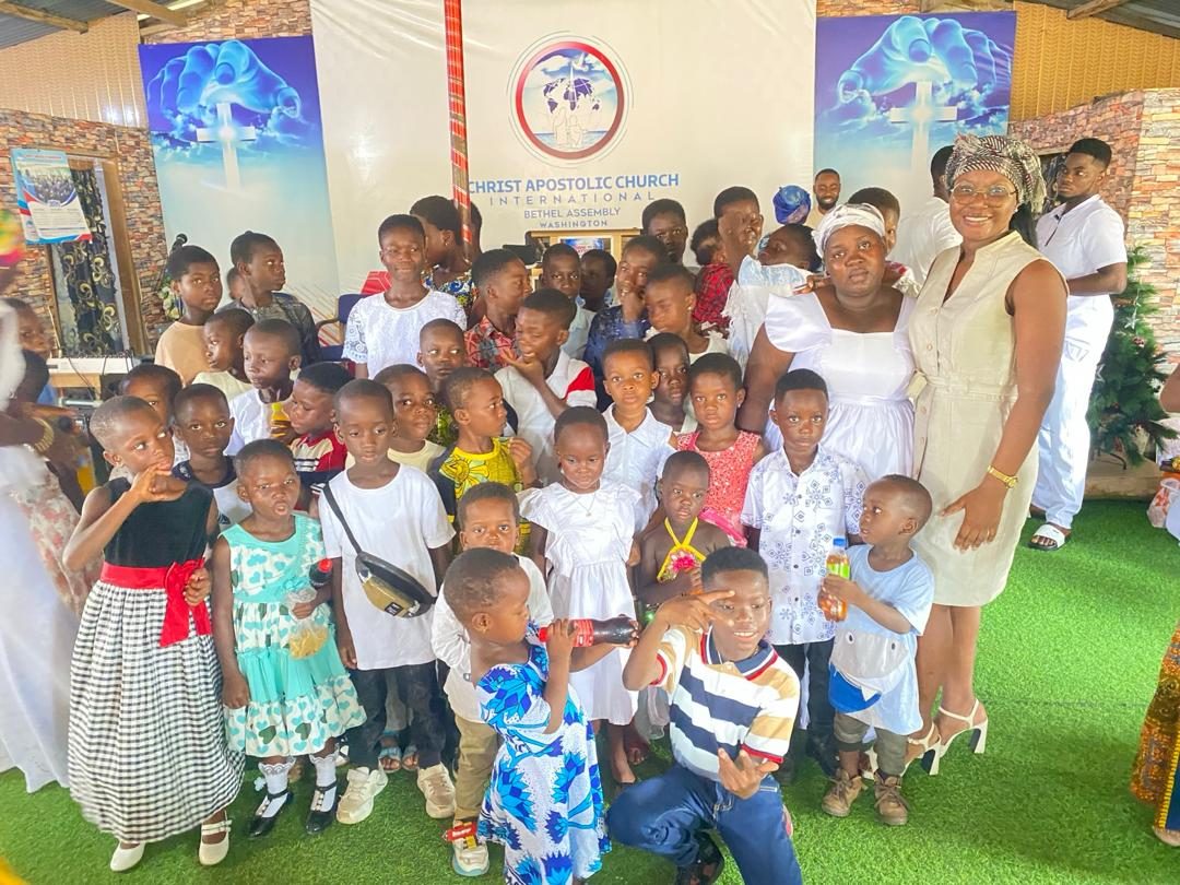 Children and volunteers smiling together at a Sunshine Project outreach